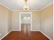 Dining room with wood floors and view into living room at 1312 Leland Dr # 61, Sun City Center, FL 33573