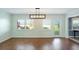 Dining room with hardwood floors, light walls, and a view of the backyard at 1312 Leland Dr # 61, Sun City Center, FL 33573