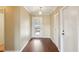 Light and bright entryway with wood floors and coat closet at 1312 Leland Dr # 61, Sun City Center, FL 33573