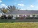 Single-story home with gray roof and landscaping at 1312 Leland Dr # 61, Sun City Center, FL 33573