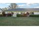 Front view of house with landscaping and grassy area at 1312 Leland Dr # 61, Sun City Center, FL 33573
