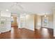 Open living area with built-in shelving and hardwood floors at 1312 Leland Dr # 61, Sun City Center, FL 33573