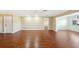 Spacious living area with hardwood floors and a view to dining area at 1312 Leland Dr # 61, Sun City Center, FL 33573