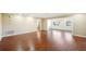 Spacious living room with hardwood floors and a ceiling fan at 1312 Leland Dr # 61, Sun City Center, FL 33573