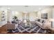 Virtually staged living room with hardwood floors and stylish rug at 1312 Leland Dr # 61, Sun City Center, FL 33573
