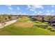 Aerial view showing a golf course and houses nearby at 14157 Feather Sound Dr, Clearwater, FL 33762