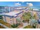 Condominium complex with courtyard and tropical landscaping at 147 Bluff View Dr # 106, Belleair Bluffs, FL 33770