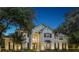 Elegant two-story home beautifully lit at night, showcasing its architectural details at 15612 Cochester Rd, Tampa, FL 33647