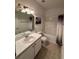 Clean bathroom with tub shower, vanity, and tiled floor at 15848 Fishhawk Falls Dr, Lithia, FL 33547