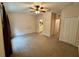 Spacious bedroom with ceiling fan and en-suite bathroom at 15848 Fishhawk Falls Dr, Lithia, FL 33547