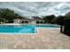 Community pool area with pool house and seating at 15848 Fishhawk Falls Dr, Lithia, FL 33547