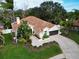 Property view shows home, landscaping, and neighborhood at 1879 Nuthatch Way, Palm Harbor, FL 34683