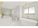Elegant bathroom with freestanding tub, double vanity, and gold fixtures at 2024 N Pebble Beach Blvd, Sun City Center, FL 33573