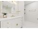 Stylish bathroom with a floating vanity and a large mirror at 2024 N Pebble Beach Blvd, Sun City Center, FL 33573