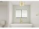 Bathroom with freestanding tub and gold fixtures at 2024 N Pebble Beach Blvd, Sun City Center, FL 33573