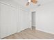 Bedroom with double closets and wood-look flooring at 2024 N Pebble Beach Blvd, Sun City Center, FL 33573