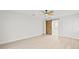 Spacious bedroom with light walls, wood-look floors and barn door to bathroom at 2024 N Pebble Beach Blvd, Sun City Center, FL 33573