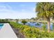 Peaceful view of the canal and lush landscaping at 2024 N Pebble Beach Blvd, Sun City Center, FL 33573