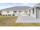 Gray door entryway with gray and white exterior at 2024 N Pebble Beach Blvd, Sun City Center, FL 33573