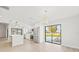 Modern kitchen with island, stainless steel appliances and view to backyard at 2024 N Pebble Beach Blvd, Sun City Center, FL 33573