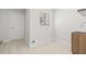 Laundry room with built-in shelving and a utility sink at 2024 N Pebble Beach Blvd, Sun City Center, FL 33573