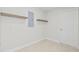 Clean laundry room with extra shelving and storage at 2024 N Pebble Beach Blvd, Sun City Center, FL 33573