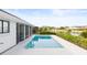 Inviting refreshing pool with a view of the canal at 2024 N Pebble Beach Blvd, Sun City Center, FL 33573