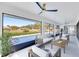 Relaxing screened lanai with pool view, seating area, and ceiling fan at 2024 N Pebble Beach Blvd, Sun City Center, FL 33573
