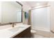 Modern bathroom with white subway tile and gray vanity at 2246 Fiesta Dr, Sarasota, FL 34231