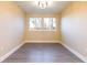 Empty bedroom with neutral walls and gray tile floors at 2246 Fiesta Dr, Sarasota, FL 34231