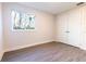 Empty bedroom with neutral walls and gray tile floors at 2246 Fiesta Dr, Sarasota, FL 34231