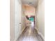 Bright and airy entryway with tiled floors and staircase at 2246 Fiesta Dr, Sarasota, FL 34231
