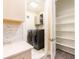 Convenient laundry area with washer, dryer, and shelving at 2246 Fiesta Dr, Sarasota, FL 34231