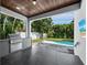 Outdoor kitchen with stainless steel grill and granite countertops at 2246 Fiesta Dr, Sarasota, FL 34231