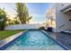 Relaxing rectangular pool with blue tile accents at 2246 Fiesta Dr, Sarasota, FL 34231