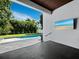 View of refreshing pool and backyard from covered patio at 2246 Fiesta Dr, Sarasota, FL 34231
