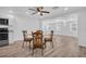 Open concept dining room with hardwood floors and modern decor at 2514 Ohio S Ct, Gulfport, FL 33707