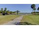 Peaceful golf course landscape with a bridge and pond at 2614 Cove Cay Dr # 409, Clearwater, FL 33760