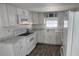 Modern kitchen with white cabinets and granite countertops at 27466 Us Highway 19 N # 97, Clearwater, FL 33761