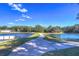 Concrete path along a pond in a wooded community at 2821 Holly Bluff Ct, Plant City, FL 33566