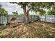 Cozy backyard with a wicker chair and mature tree at 2883 16Th Ave N, St Petersburg, FL 33713