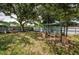Backyard with a pergola and seating area under a large tree at 2883 16Th Ave N, St Petersburg, FL 33713