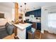 Modern kitchen with navy blue cabinetry, granite countertops, and stainless steel appliances at 2883 16Th Ave N, St Petersburg, FL 33713