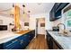 Open concept kitchen boasts navy blue cabinets, wood countertops and breakfast bar at 2883 16Th Ave N, St Petersburg, FL 33713
