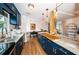 View of kitchen with an island, navy blue cabinets and wood countertops at 2883 16Th Ave N, St Petersburg, FL 33713