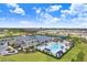 Resort-style pool and clubhouse with surrounding landscape at 3278 Woodland Brook Way, Wesley Chapel, FL 33543