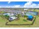 Aerial view of community amenities including pools, tennis courts, playground, and clubhouse at 3278 Woodland Brook Way, Wesley Chapel, FL 33543