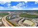 House nestled in a community near a lake and main road at 3278 Woodland Brook Way, Wesley Chapel, FL 33543