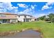 Houses with backyard views overlooking a pond at 3278 Woodland Brook Way, Wesley Chapel, FL 33543