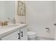 Small bathroom with white cabinets and quartz countertop at 3278 Woodland Brook Way, Wesley Chapel, FL 33543